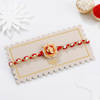 Buy Auspicious Pearl And Meena Work Ganesha Rakhi