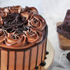 Shop Dark Chocolate Ganache Cake With Basket Of Peach Roses