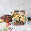 Dark Chocolate Ganache Cake With Basket Of Peach Roses Online
