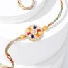 Buy Enchanting Navratna Rakhi And Gulab Jamun Combo