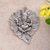 Metal Ganesha Carved on a Leaf - Wall Hanging Online