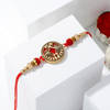 Gift Peacock Splendor Rakhi And Dry Fruits
