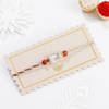 Buy Silver-Plated Peacock Feather Rakhi