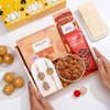 Temple Design Rakhi With Scrumptious Goodies Hamper