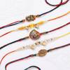 Gift Vibrant Peacock And Pearl Rakhis - Set Of 5