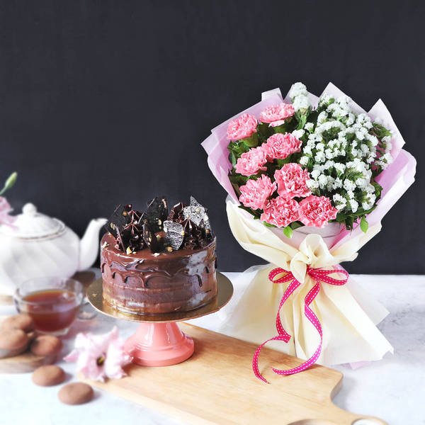 Hazelnut Crunch Cake With Bunch Of Light Carnations