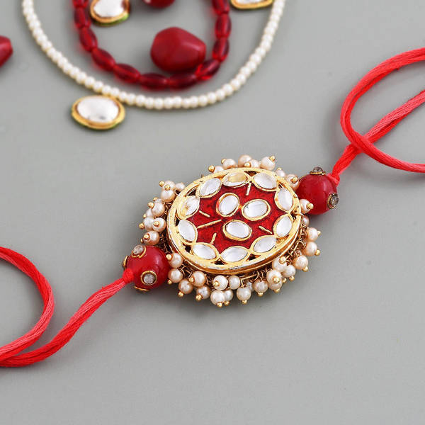 Kundan And Pearls Oval Red Rakhi