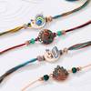 Graceful Peacock Feather Rakhis-Set Of 4