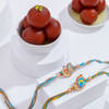 Radiant Peacock Motif Rakhi Duo With Gulab Jamun